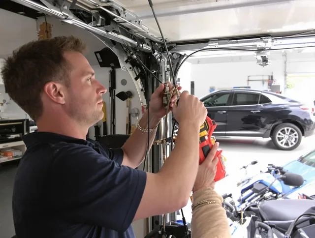 Mayfield Heights Garage Door Repair safety certified technician performing cable replacement in Mayfield Heights