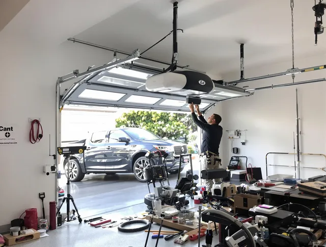 Mayfield Heights Garage Door Repair specialist installing smart garage door opener system in Mayfield Heights home