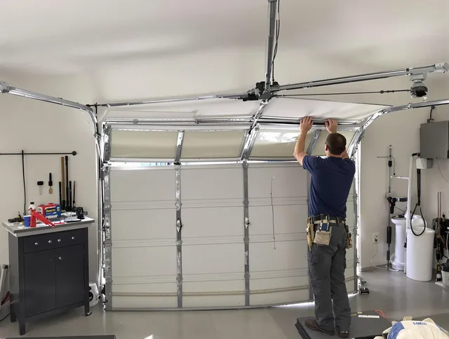 Mayfield Heights Garage Door Repair specialist performing precise section replacement on Mayfield Heights garage door